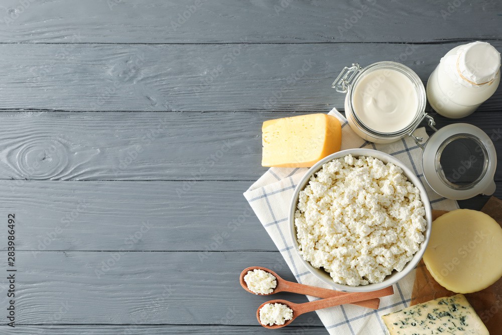 Flat lay. Different dairy products on grey wooden background, copy space Flat lay. Different dairy products on grey wooden background, copy space