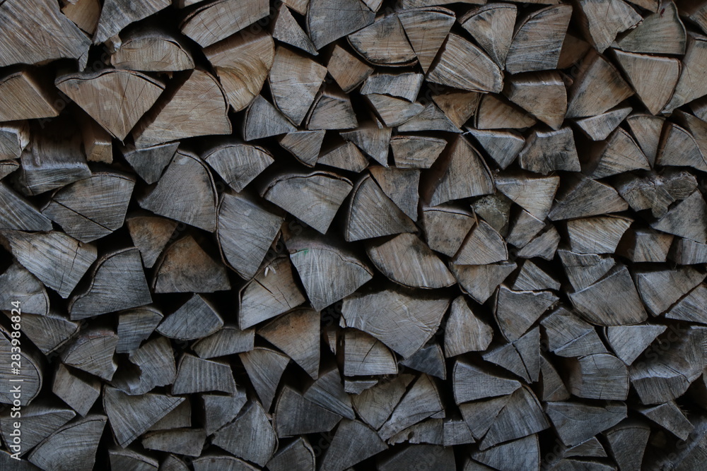 Firewood dry firewood in a pile for furnace kindling. Rustic background of logs Firewood dry firewood in a pile for furnace kindling. Rustic background of logs