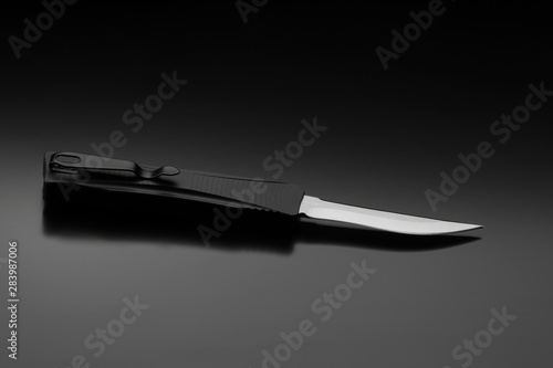 Wallpaper Mural Penknife on a black gradient background. Modern folding knife. Torontodigital.ca