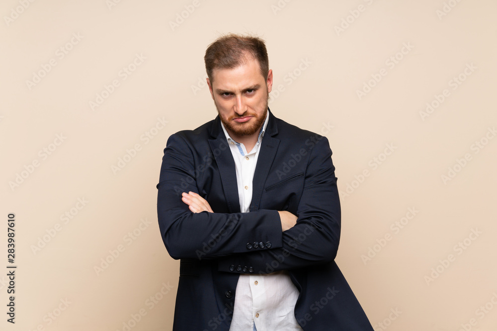 Blonde man over isolated background feeling upset Blonde man over isolated background feeling upset