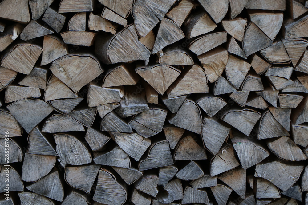 Firewood dry firewood in a pile for furnace kindling. Rustic background of logs Firewood dry firewood in a pile for furnace kindling. Rustic background of logs