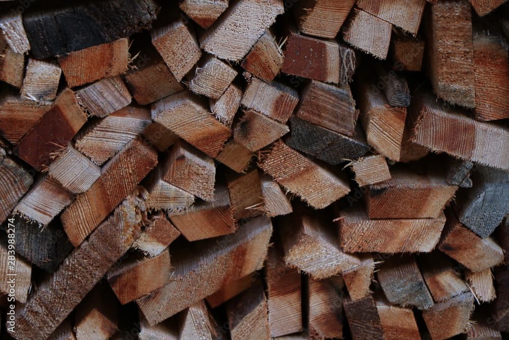 Firewood dry firewood in a pile for furnace kindling. Rustic background of logs Firewood dry firewood in a pile for furnace kindling. Rustic background of logs