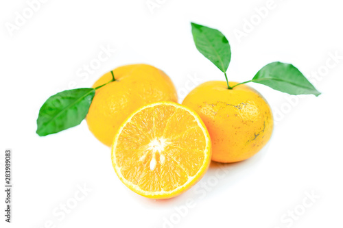 Orange fruits with leaf on isolated white background.