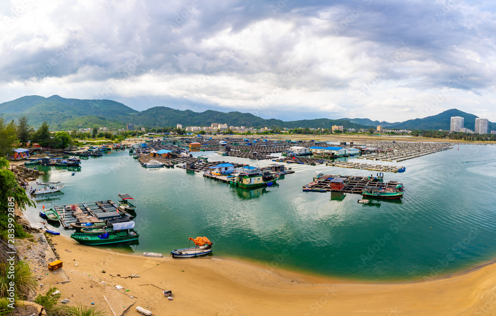 A fishing village of fishermans on the sea water in island Hainan in China