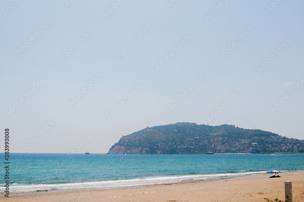 Alanya beach, beautiful place for rest, Sean and bright blue sky.  Turkey wonderful landscape.