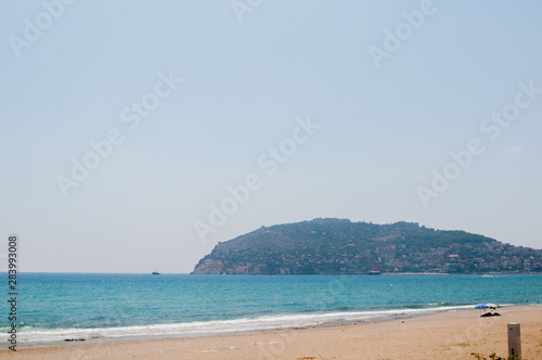 Alanya beach, beautiful place for rest, Sean and bright blue sky. Turkey wonderful landscape.
