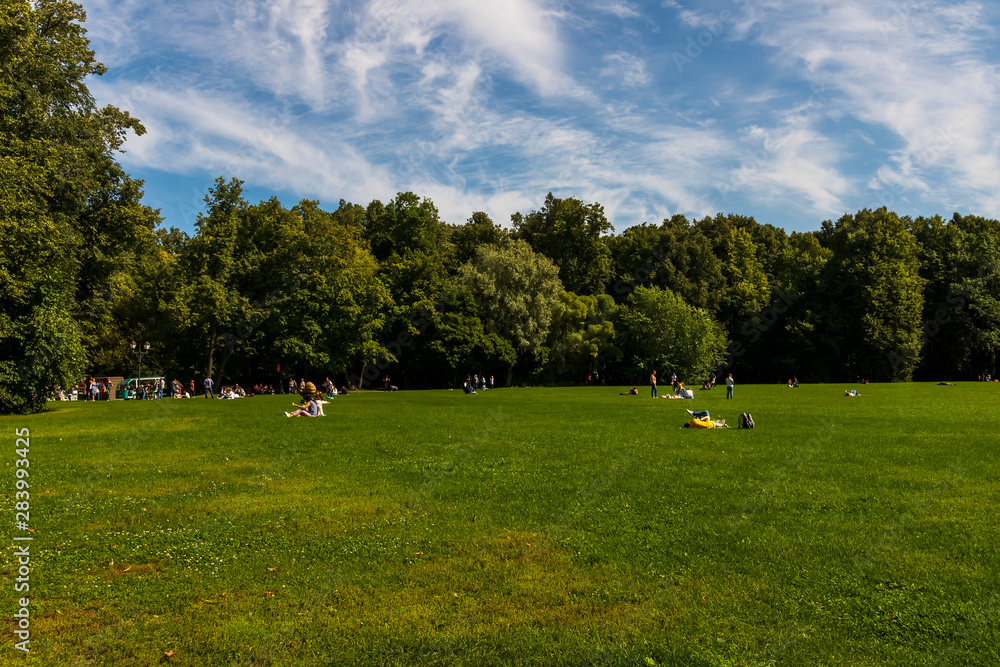 green city park during a sunny day , place of urban rest for citizens in a holyday with fine weather