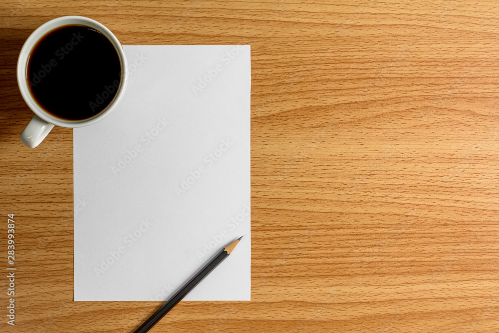 blank note paper and a pencil on wooden desk. - blank space for advertising text. blank note paper and a pencil on wooden desk. - blank space for advertising text.