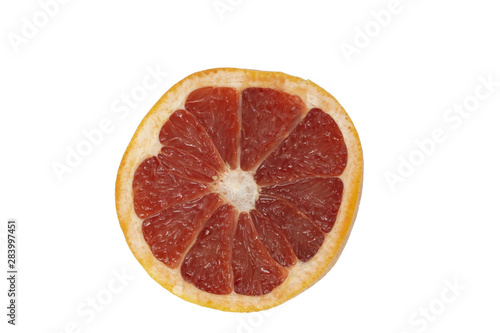 a pomelo or grapefruit cut in half isolated on a white background