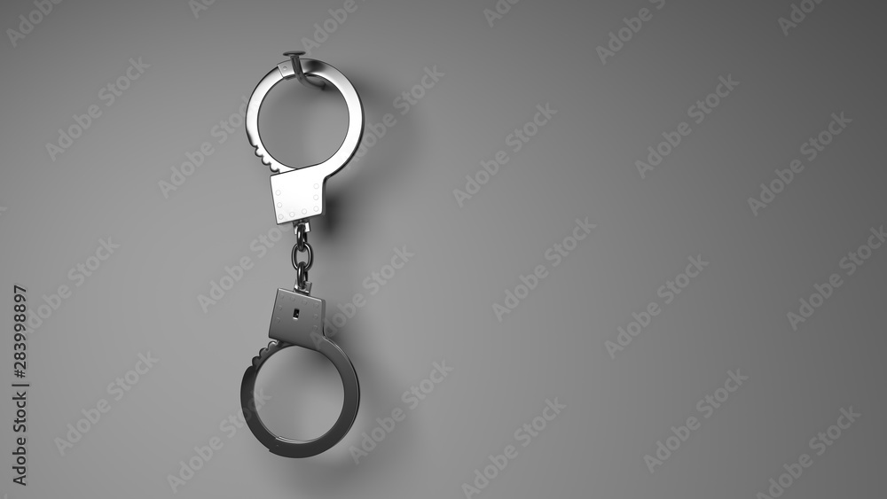 Dangling handcuffs on a nail. Dangling handcuffs on a nail.