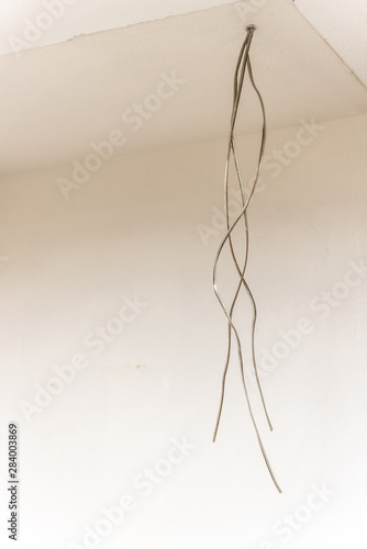 wires dangling from ceiling