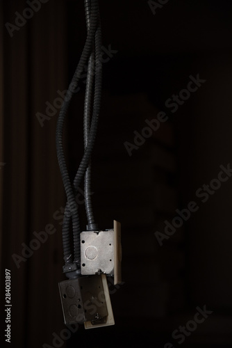 electrical outlets dangling from ceiling