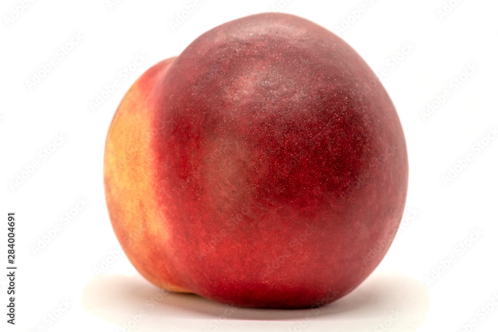 Juicy peach-nectarine isolated on white background