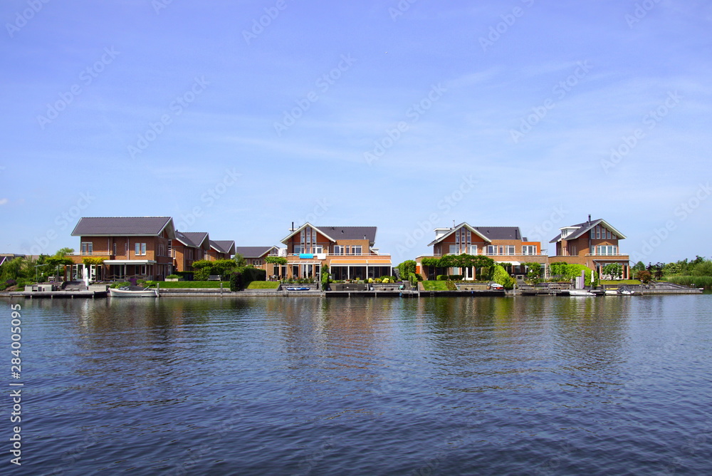 Dutch houses on the waterside in the city of Almere. 