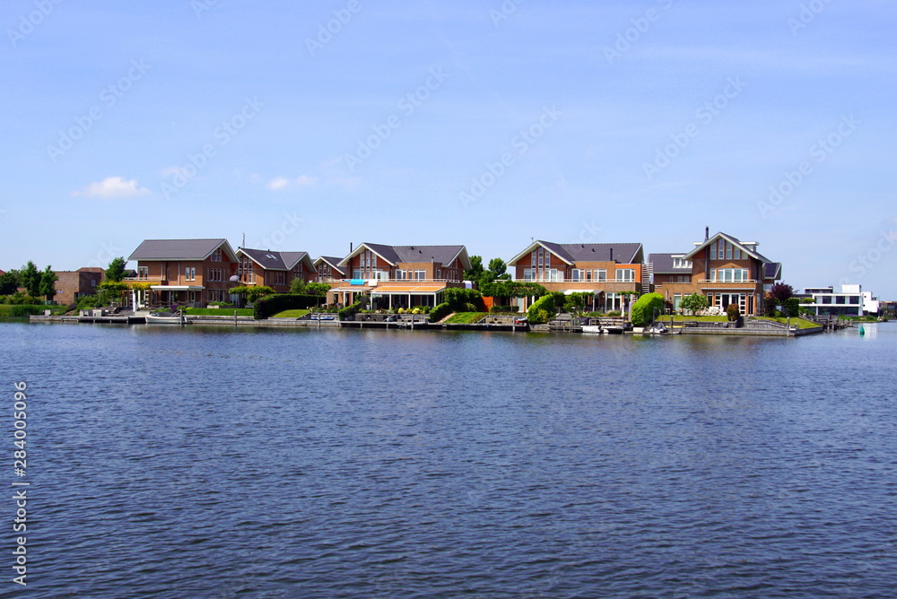  Dutch houses on the waterside in the city of Almere. 