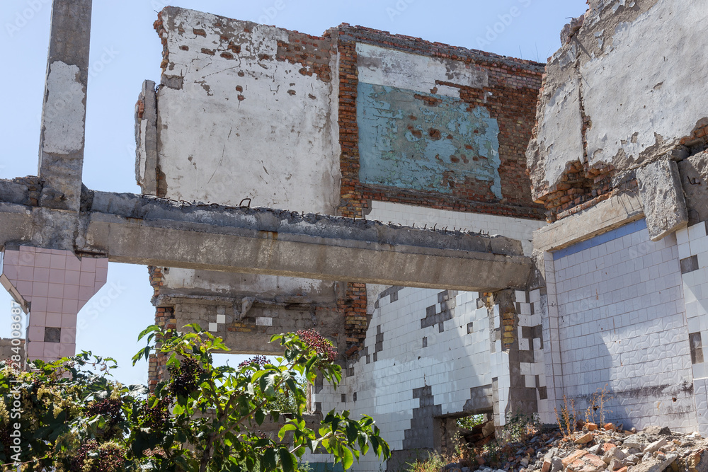 Ruined house. Remains of old houses. Apocalypse. Abandoned city. City of ghosts. Ruins of old historic houses destroyed by an earthquake and devastating operation of urban structures. Broken building Ruined house. Remains of old houses. Apocalypse. Abandoned city. City of ghosts. Ruins of old historic houses destroyed by an earthquake and devastating operation of urban structures. Broken building