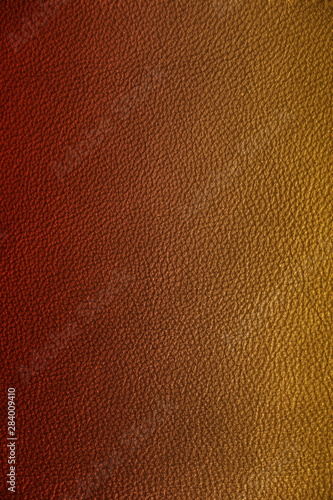 Texture of genuine leather. Gentle color leather texture closeup. Colorful background with gradient.