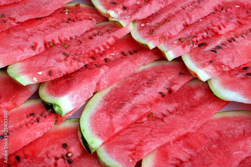 the row slices fresh ripe watermelon closeup