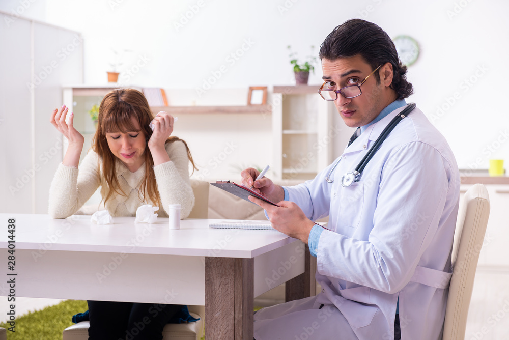 Fototapeta premium Young female patient discussing with male psychologist personal