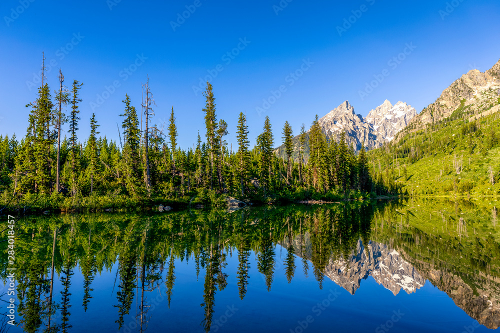 Lake with Reflection of Mountains in the Morning