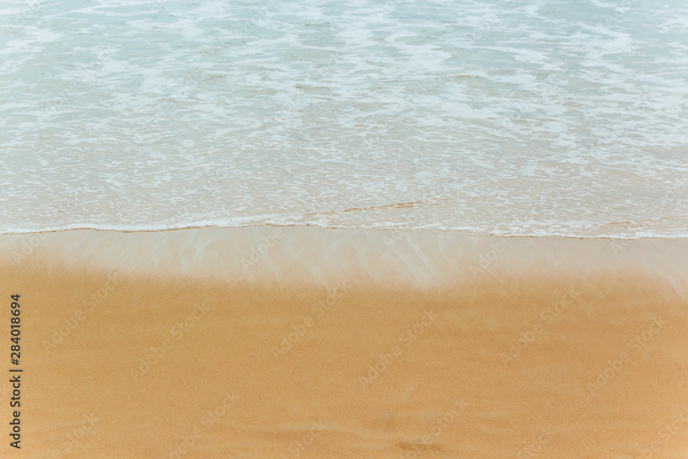 Soft Blue ocean wave on sandy beach. tropical white sand With the sea at the corner. Soft Blue ocean wave on sandy beach. tropical white sand With the sea at the corner.