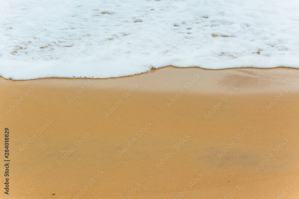 Soft Blue ocean wave on sandy beach. tropical white sand With the sea at the corner. Soft Blue ocean wave on sandy beach. tropical white sand With the sea at the corner.