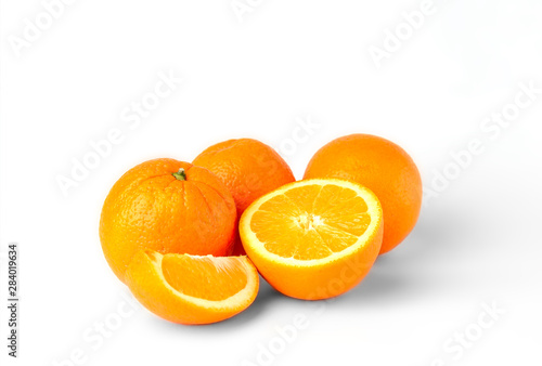 Sliced oranges fruit segments isolated on white background