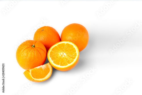 Sliced oranges fruit segments isolated on white background
