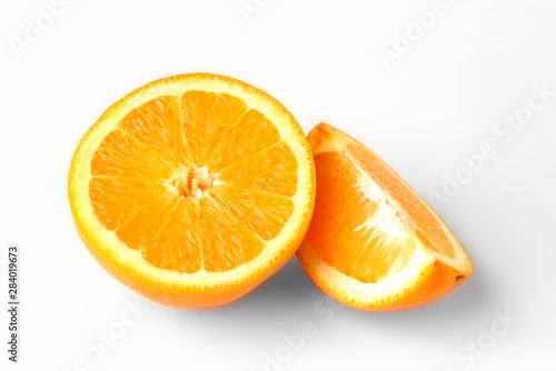Orange fruit with slice isolated on white background.