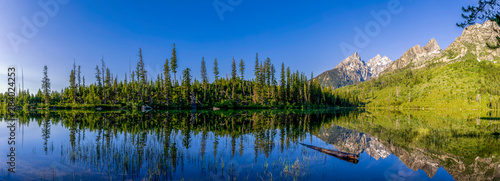 Panorama of Mountains and Forest in Lake Reflection