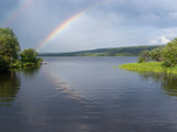 Northern BC calm taiga lake rainbow Canada