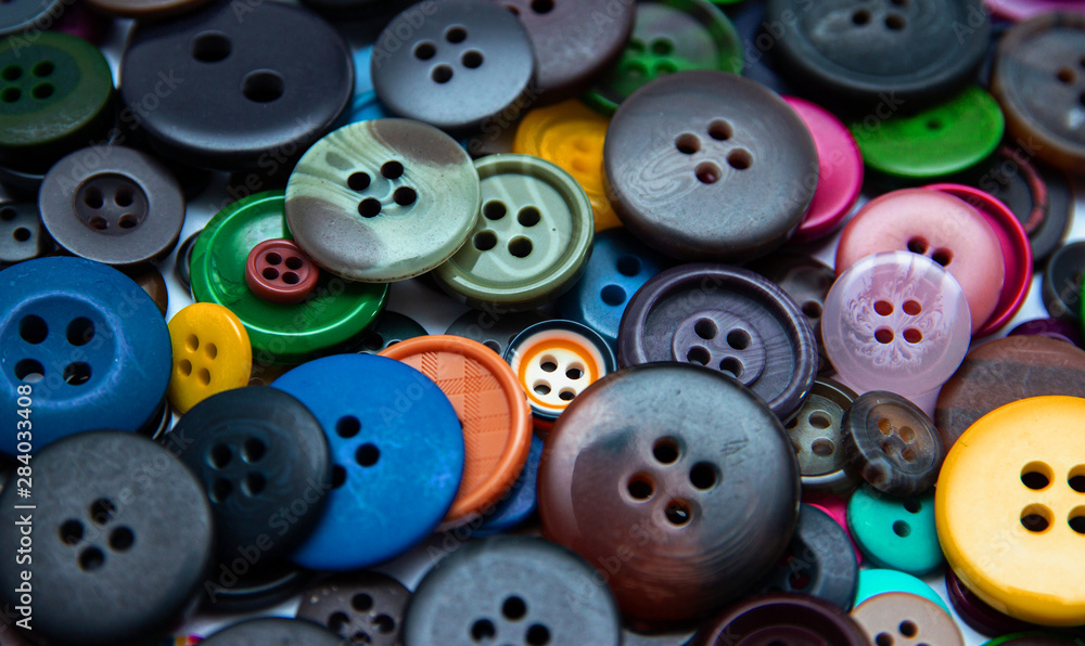 Background from multi-colored randomly scattered buttons. Background from multi-colored randomly scattered buttons.