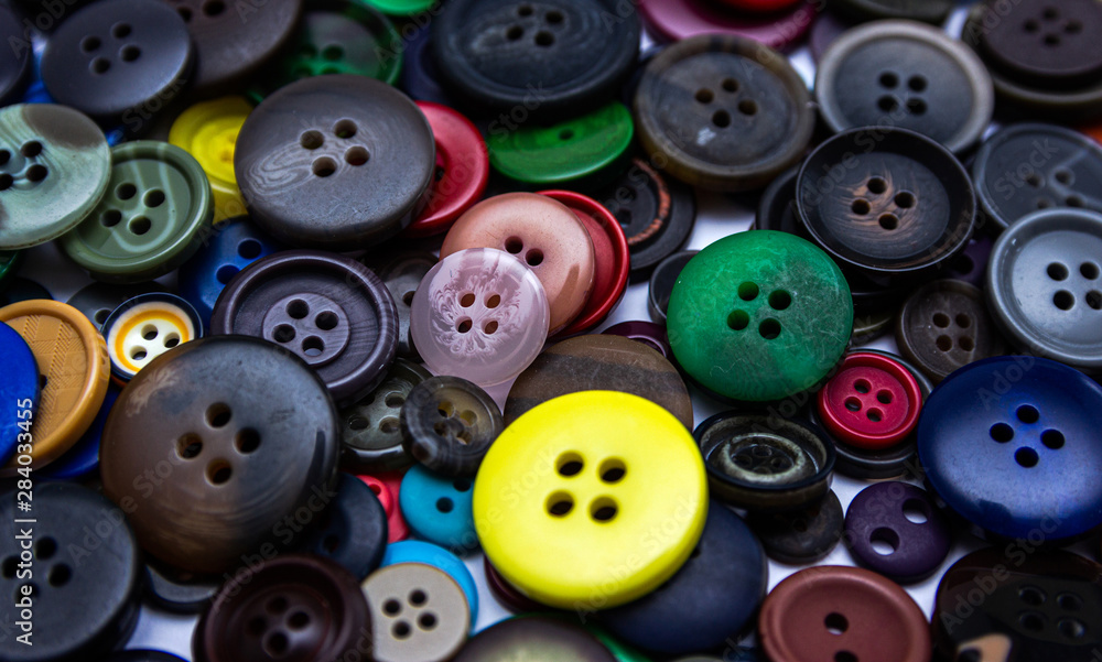 Background from multi-colored randomly scattered buttons. Background from multi-colored randomly scattered buttons.