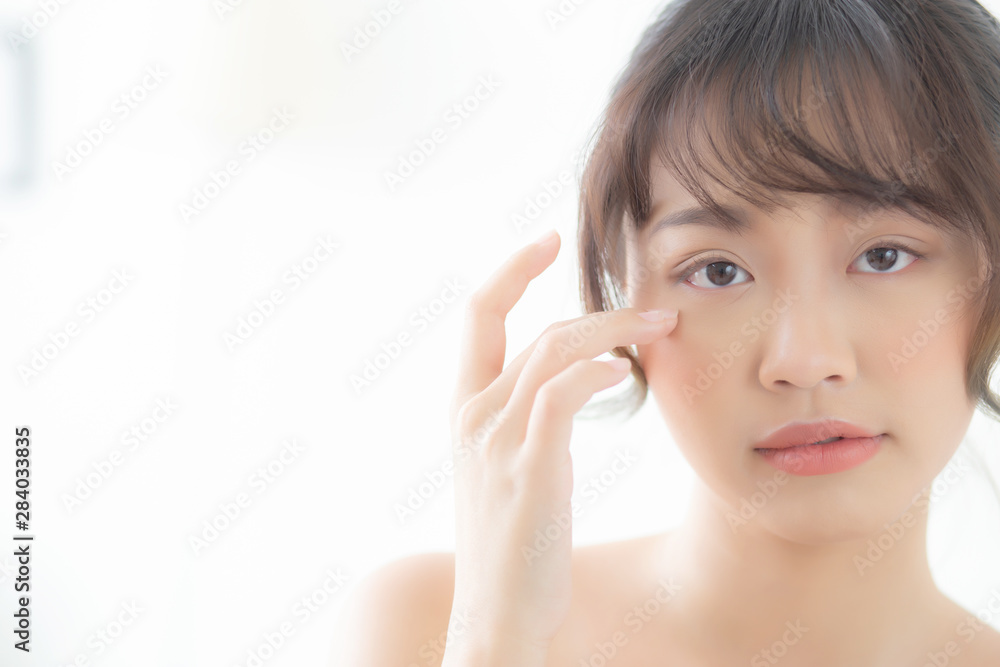 Portrait of beautiful young asian woman smile healthy and wellness at the bedroom, beauty asia girl skin care touch eye makeup and cosmetic with happy with fresh, lifestyle and relax concept. Portrait of beautiful young asian woman smile healthy and wellness at the bedroom, beauty asia girl skin care touch eye makeup and cosmetic with happy with fresh, lifestyle and relax concept.