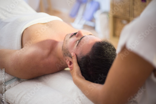 woman having a massage on a young boy 