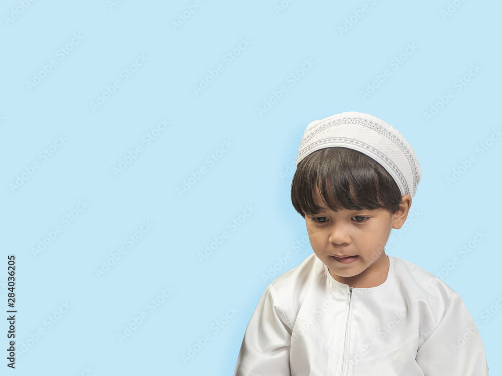 Muslim boy in a dress , isolate background Muslim boy in a dress , isolate background