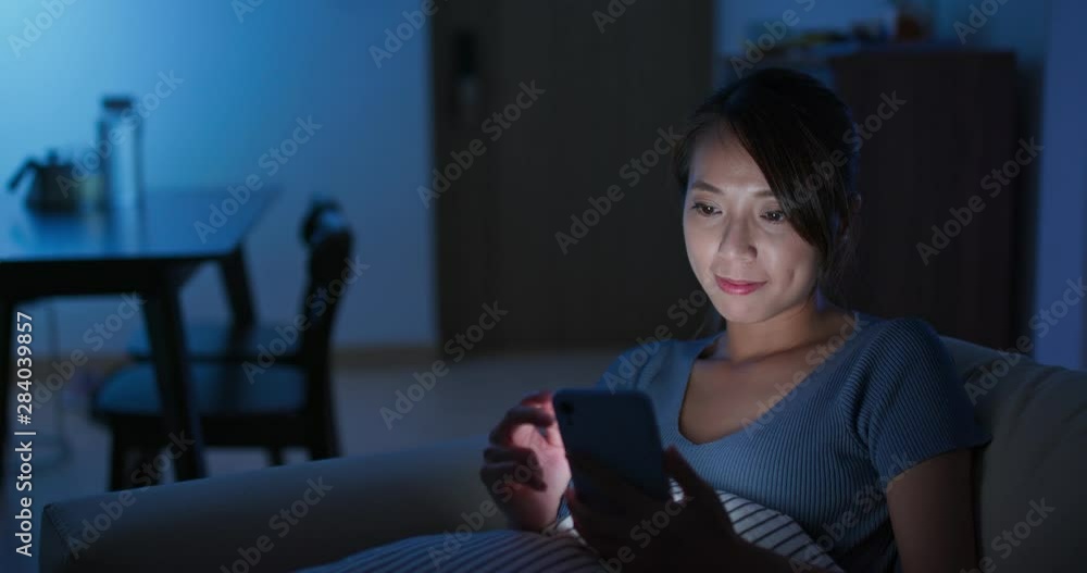 Woman use of mobile phone at home Woman use of mobile phone at home
