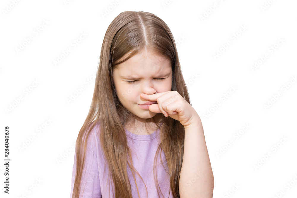 The little girl strongly scratches a nose. It is isolated on a white background. The little girl strongly scratches a nose. It is isolated on a white background.
