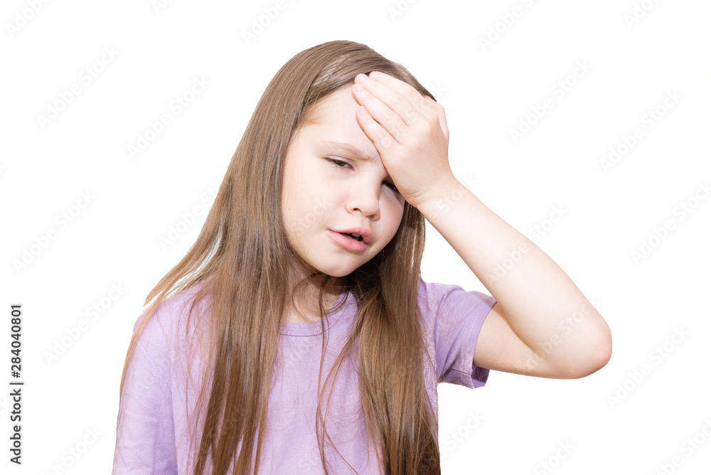 Fototapeta premium The little girl put a hand on a forehead, and complains of a headache. It is isolated on a white background.