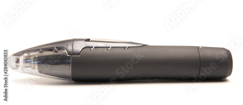 hair trimmer lies on a white background
