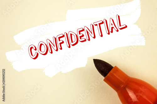 Handwriting text writing Confidential. Concept meaning Agreements between two parties are private and protected written Painted background Marker next to it. photo