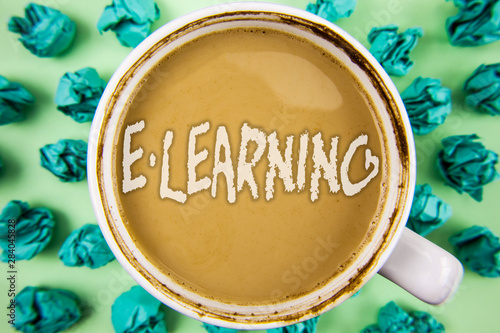 Word writing text E-Learning. Business concept for Introduction of an electronic education in modern schools written Tea in White Cup within Crumpled Paper Balls plain background.