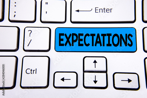 Writing note showing Expectations. Business photo showcasing Huge sales in equity market assumptions by an expert analyst written Blue Key Button White Keyboard with copy space. Top view.
