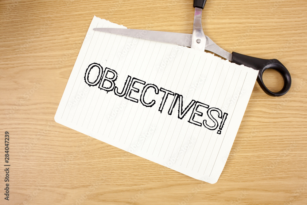 Conceptual hand writing showing Objectives Motivational Call. Business photo text Goals planned to be achieved Desired targets written Tear Notebook Paper wooden background Scissor. Conceptual hand writing showing Objectives Motivational Call. Business photo text Goals planned to be achieved Desired targets written Tear Notebook Paper wooden background Scissor.