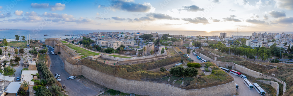 Aerial summer sunset view of Acco, Acre, Akko medieval old city with green roof Al Jazzar mosque and crusader palace, city walls, arab market, knights hall, crusader tunnels, in Israel Aerial summer sunset view of Acco, Acre, Akko medieval old city with green roof Al Jazzar mosque and crusader palace, city walls, arab market, knights hall, crusader tunnels, in Israel