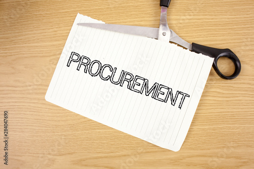 Conceptual hand writing showing Procurement. Business photo text Obtaining Procuring Something Purchase of equipment and supplies written Tear Notebook Paper wooden background Scissor. photo