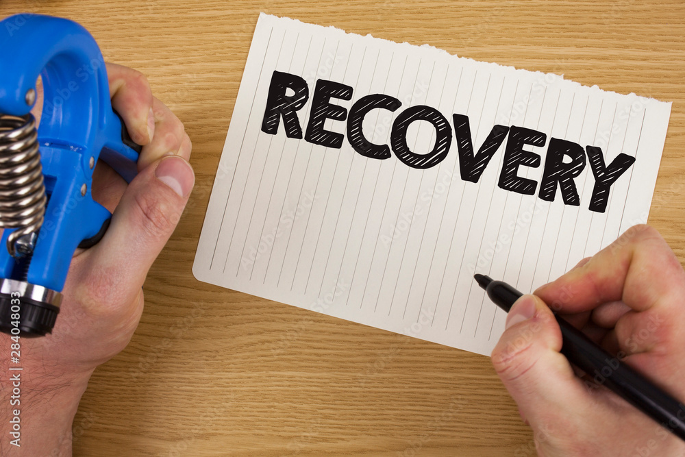 Text sign showing Recovery. Conceptual photo Return to normal state of health Regain possession or control written by Man Tear Notebook paper Marker and Tool in hand wooden background. Text sign showing Recovery. Conceptual photo Return to normal state of health Regain possession or control written by Man Tear Notebook paper Marker and Tool in hand wooden background.