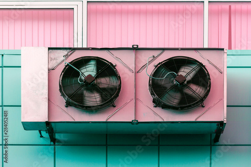 Air conditioning evaporators on the wall of an office building.  Front view from below.
