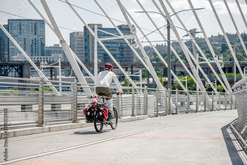 Male cyclist in sportswear rides a bicycle on the Tilikum Crossing Bridge