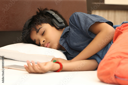 Indian Teen boy fell asleep on bed